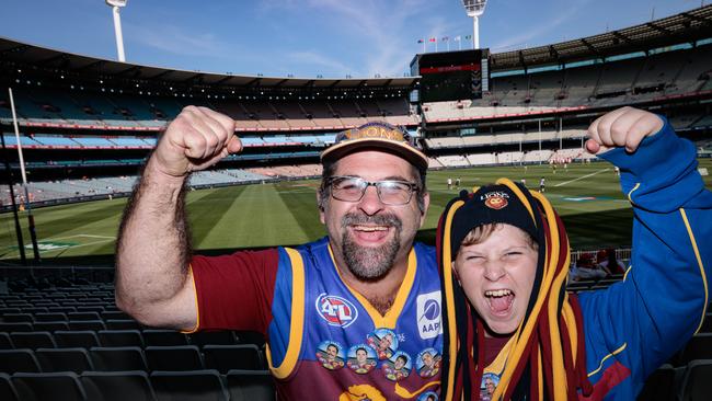 Brisbane Lions fans Adrian and Cameron Sinclair at the MCG. Picture: NewsWire/Nadir Kinani