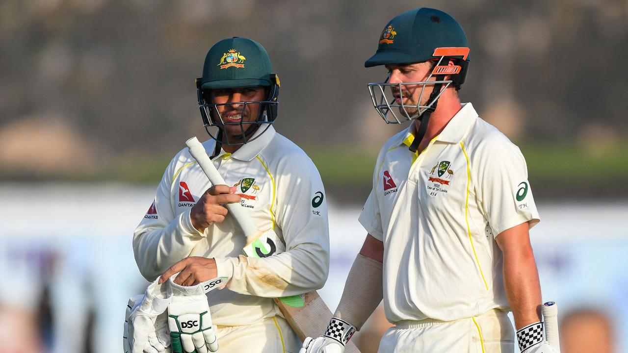 Australian batsmen Usman Khawaja (left) and Travis Head walk back to the pavilion at the end of the first day of the first Test match against Sri Lanka at the Galle International Cricket Stadium. Picture: AFP