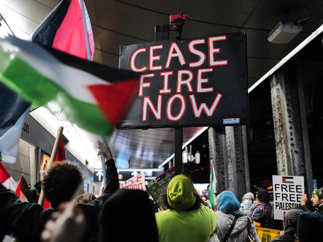 Pro-Palestine protester gather at Jamaica train station in New York City on January 27, 2024. Intense fighting raged in the Gaza city of Khan Yunis, the main theatre of conflict where the Israeli army is targeting Hamas. The unabated hostilities came a day after the UN's International Court of Justice in The Hague ruled Israel must prevent possible acts of genocide in the conflict but stopped short of calling for a ceasefire. (Photo by Charly TRIBALLEAU / AFP)