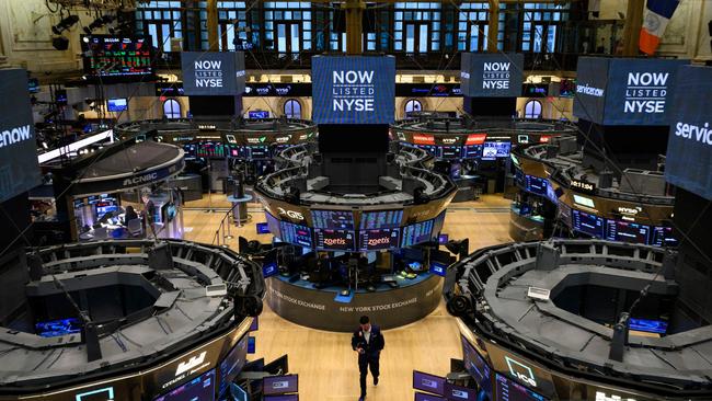 Traders work on the floor of the New York Stock Exchange.