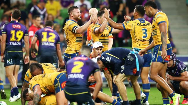 Parramatta players celebrate their golden point win over Melbourne.