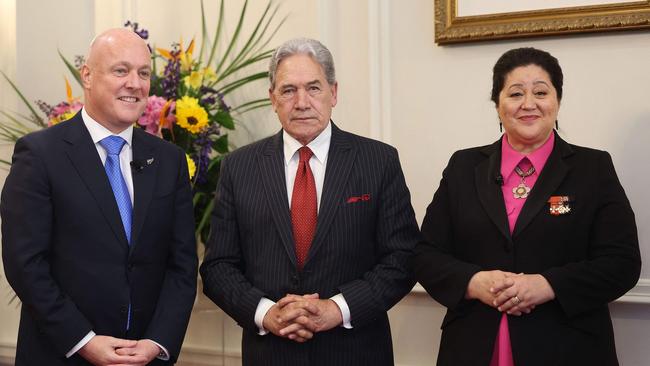 Christopher Luxon, Winston Peters, and New Zealand's Governor General Dame Cindy Kiro attend the swearing-in of the new government. Picture: AFP.