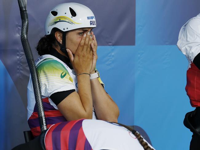 Jess Fox watches on as she sits in the gold medal chair after her run.. Picture: Michael Klein