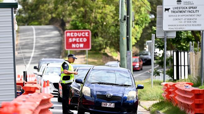 Police inspect vehicles crossing the border from New South Wales into Queensland at Coolangatta on the Gold Coast earlier this year. Picture: NCA NewsWire / Dan Peled