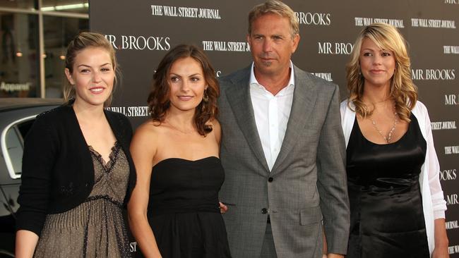 The couple, seen here in 2007 with daughters Lily (far left) and Annie (left), are feuding over money and property. Picture: Getty