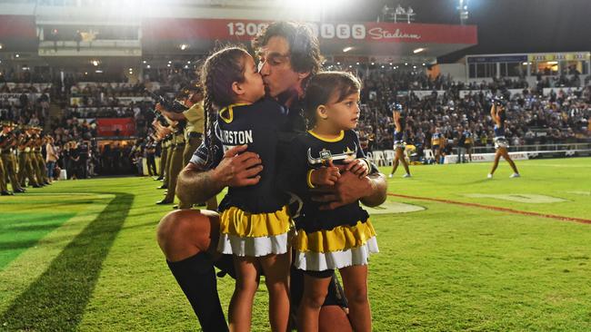 Townsville. Cowboys Johnathan Thurston runs out into the field with daughters Frankie and Charlie. Picture: Zak Simmonds