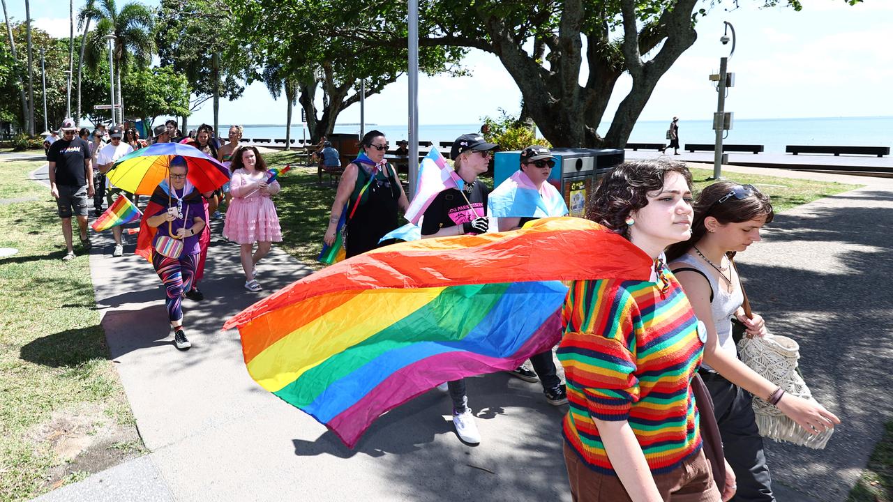 A small group of LGBTIQ people and supporters paraded along the Cairns Esplanade with a huge rainbow flag for the Pride Stride, part of the Cairns Pride Festival. Picture: Brendan Radke