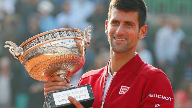 WORLD No.1: Novak Djokovic of Serbia holds the winner's trophy during the victory ceremony for the French Open.