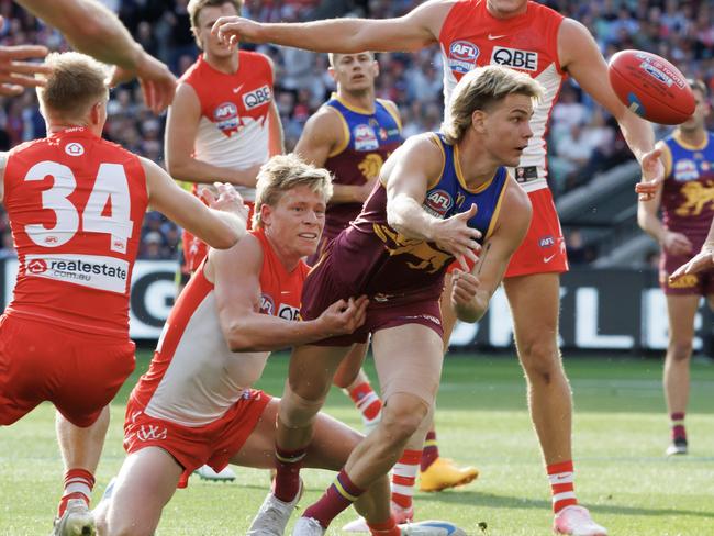 Will Ashcroft tackled by Isaac Heeney during the AFL Grand Final between the Brisbane Lions and Sydney Swans at the MCG. Picture Lachie Millard