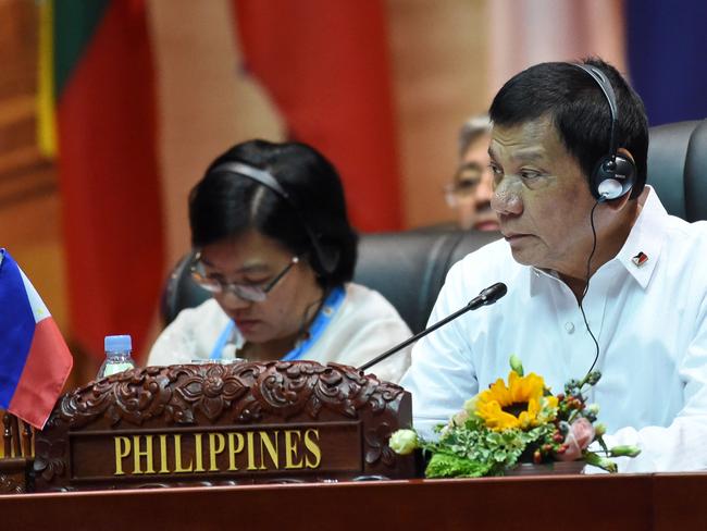 Philippine President Rodrigo Duterte (R) attends the plenary session the opening ceremony of the Association of Southeast Asian Nations (ASEAN) Summit in Vientiane.