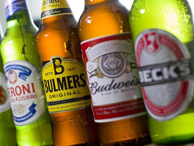 Bottles of beer and cider produced by Belgian-Brazilian group Anheuser-Busch InBev, (Budweiser, Corona, Stella and Beck's) and British brewer SABMiller (Bulmers and Peroni) are pictured in London, on October 13, 2015. British brewer SABMiller announced Tuesday it had finally agreed a takeover by Anheuser-Busch InBev, the world's biggest beer producer -- for about $109 billion. Including debt, the cost of buying SABMiller is around $117 billion (£77 billion, 103 billion euros), making it the world's third biggest takeover after two mega mergers across the telecoms sector. AFP PHOTO/JUSTIN TALLIS