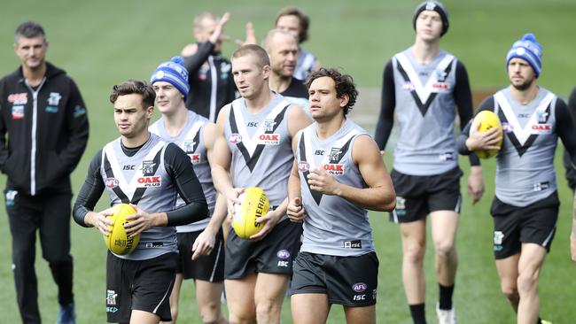 Karl Amon, Tom Clurey and Steven Motlop lead the way at Port Adelaide training on Wednesday. Picture: Sarah Reed