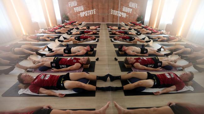 St Kilda players have been doing yoga in the heat at Upstate Studio, with the room so humid it even had an effect on the Herald Sun’s cameras. Picture: Alex Coppel