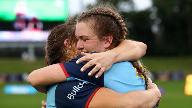 Brianna Hoy and Kaitlan Leaney celebrate together after winning the 2021 Super W title with the Waratahs