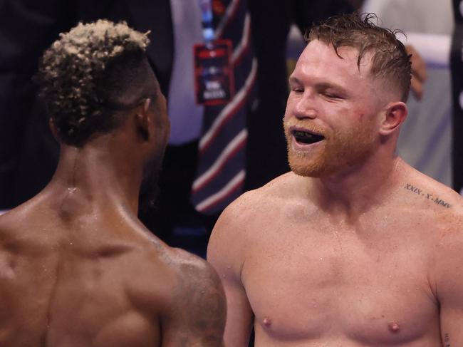 Mexico's Canelo Alvarez (R) speaks to Cuba's William Scull after winning their super middleweight boxing match at The Venue in Riyadh on May 4, 2025. (Photo by Fayez NURELDINE / AFP)