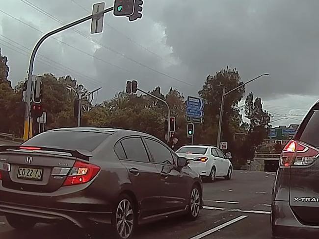 The pair were seen pounding on the window. Picture: Dashcam Owners Australia