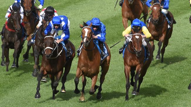 Winx cruises past Hartnell and Black Heart Bart, who are unable to keep up. Picture: Tony Gough