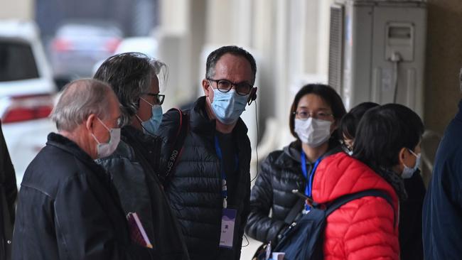 Peter Embarek (C) and other members of the WHO team in Wuhan. Picture:AFP