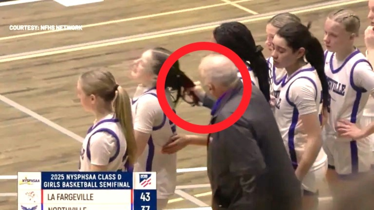 Coach Zullo continues berating Monroe after he yanked her hair. Photo: News10/NFHS Network.