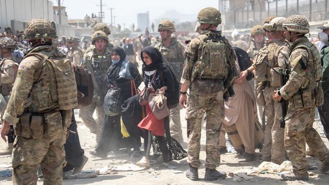 Members of the British armed forces work with the US military to evacuate eligible civilians out of Kabul, Afghanistan. Picture: Getty Images