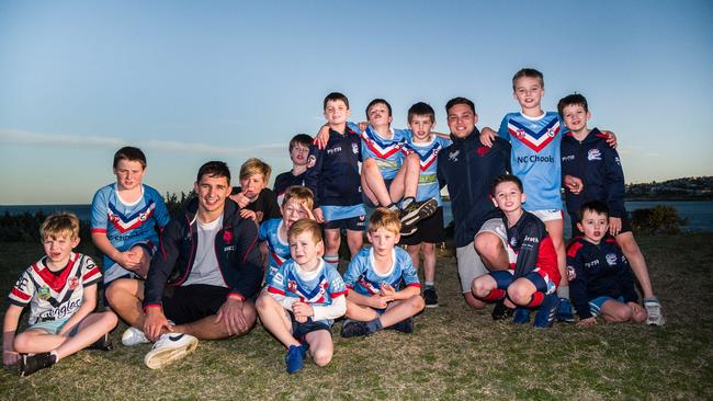 ictor Radley and Lachlan Lam with young members of their former club the Clovelly Crocodiles. Picture: James Gourley