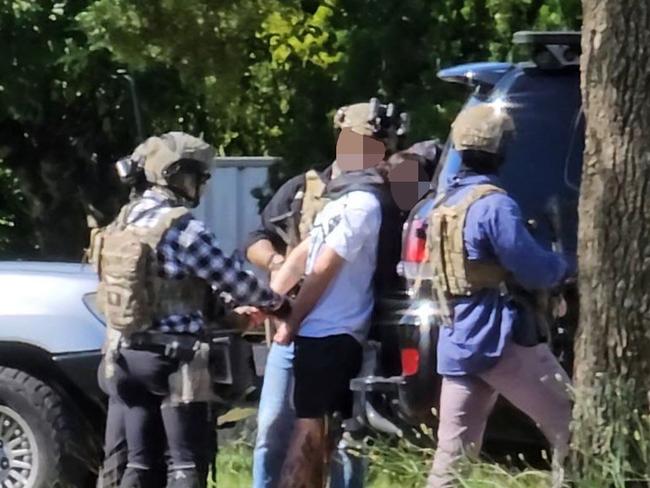 Watch: Armed police take man into custody after regional Qld standoff