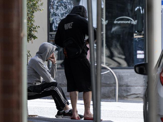 Two men score drugs in Melbourne’s CDB. Picture: David Geraghty