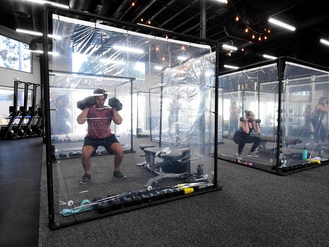 People exercise behind plastic sheets in California. Picture: AFP