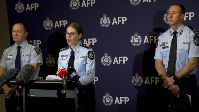 AFP Assistant Commissioner Justine Gough (middle), QPS Acting Assistant Commissioner Col Briggs (right), and NSWPS Assistant Commissioner Michael Fitzgerald announce the man’s arrest. Picture: Mohammad Alfares