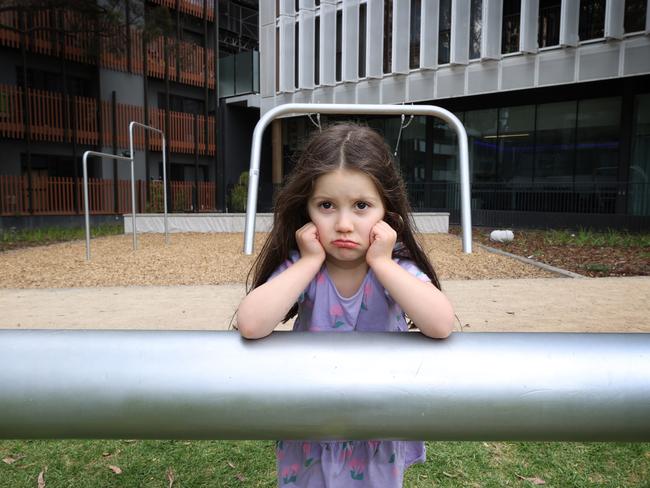 Avaline, 3, unhappy the kids play equipment was replaced with slippery metal poles. Picture: David Caird