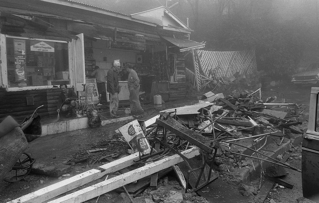 Historic: Toowoomba: Accidents: Clean up at the Log Cabin Service Station the morning after a semi-trailer rolled and crashed in the building removing most of the front of the station. The owner in 1978, Mr Neville Hammond started rebuilding immediately. Photo: Bruce Mackenzie / The Chronicle Neg: U875. Picture: Bruce Mackenzie