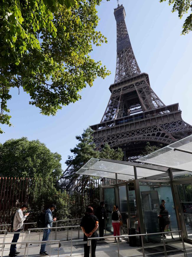 People arrive for the reopening of the Eiffel Tower in Paris on Thursday. Picture: AFP