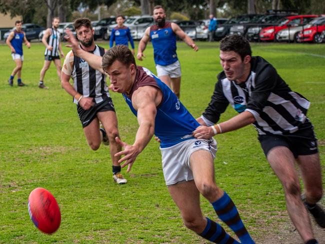 Old Peninsula's George Fletcher is tackled without the ball last season. Picture: Pearcey Photography