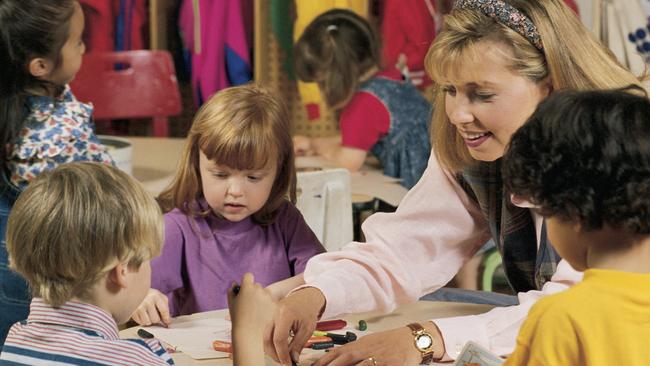 Teacher and students in kindergarten classroom