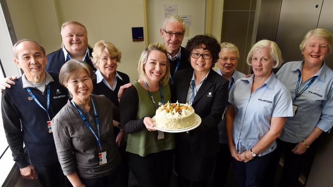 Epworth Eastern's group manager volunteer program Tara Cantwell and Nurse Unit manager Millie Flowers celebrate with a team of hospital volunteers.