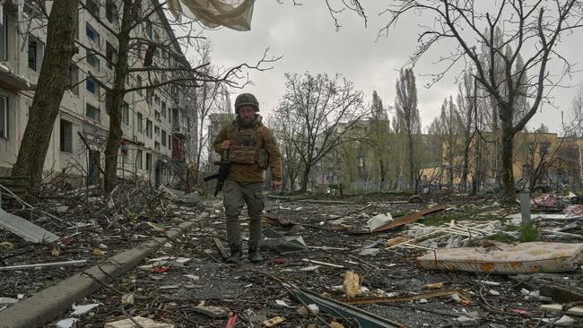 A soldier walks through the city of Pokrovsk this week. Picture: Kostiantyn Liberov/Getty Images