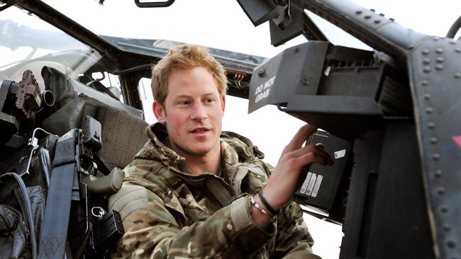 Prince Harry makes early morning helicopter pre-flight checks during his deployment to southern Afghanistan in 2012. Picture: John Stillwell
