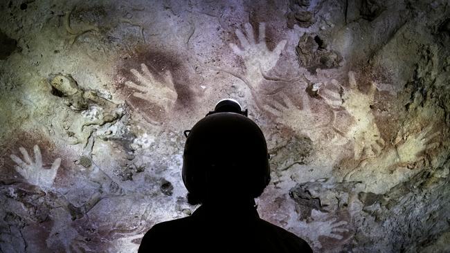 Ochre hand stencils in a Nullarbor cave convey the stories of the Mirning traditional owners. Picture: Stefan and Bronwen Eberhard