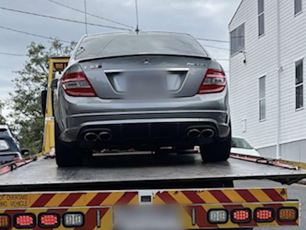 A car is taken away during the raid. Picture: QLD Police