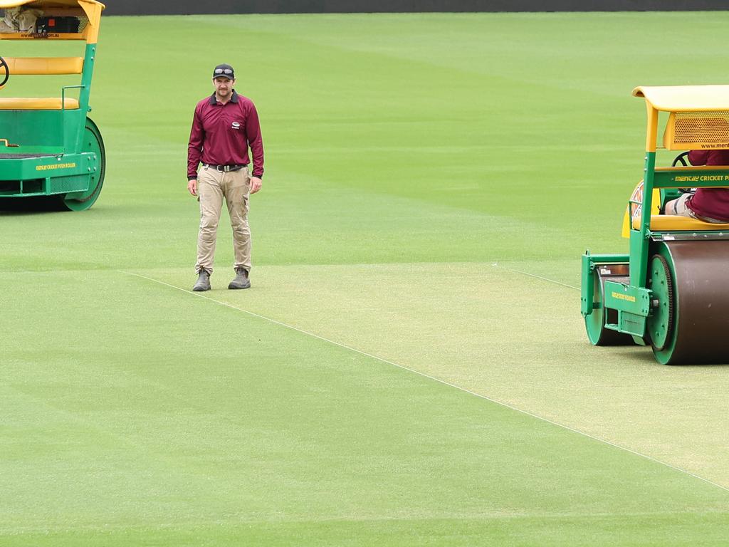 Staff work on the pitch at the Gabba ahead of the third Test starting on Saturday. Picture: Adam Head