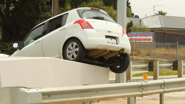 A car ended up on a concrete pillar on the Surfcaost Highway near the Baanip Blvd intersection. Picture: Alison Wynd