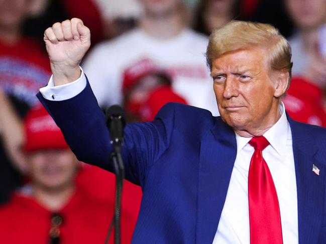 Former US President and Republican presidential candidate Donald Trump leaves the stage after a campaign rally at the Bryce Jordan Center in State College, Pennsylvania, October 26, 2024. (Photo by Charly TRIBALLEAU / AFP)