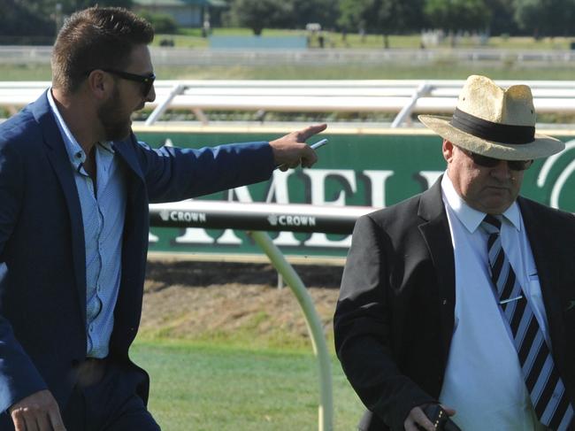 chief steward Brad Lewis (right) inspects the Ascot track with jockeys, trainers and Stewards about 80m from the finish line where two horses Lenience and Watermans Bay were participating in a training gallop between races 4 and 5. About 80m before the line Lenience ridden by Steven Parnham slipped and fell where Steven was dislodged. After the mishap stewarts in consultation with trainers and jockeys decided to postpone the final 4 events.