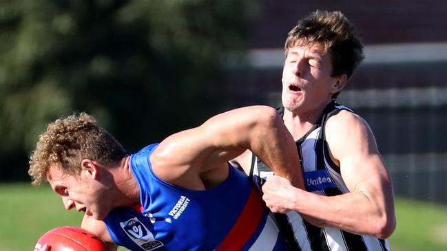 Callan Wellings (right), playing for Collingwood in 2018, is out for half of the season for his new club the Ballarat Swans. Picture: Mark Dadswell