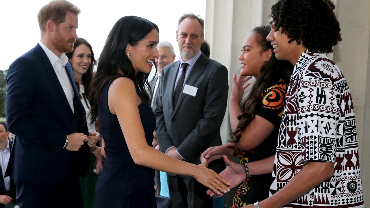 The Duke and Duchess of Sussex greet some of the young people attending the reception. Picture: Nathan Edwards