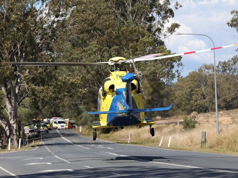 A helicopter arrives on scene at a crash between a bus and a car. Picture: Peter Wallis