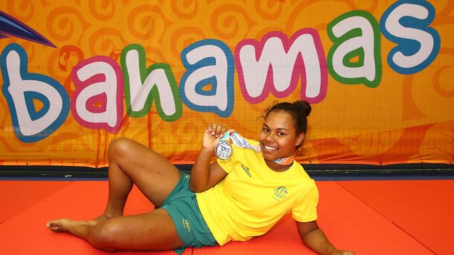 Francis Newman poses with her silver medal in the Bahamas.