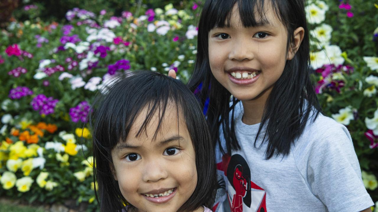 Sisters Gia (left) and Sophie Dang in The Chronicle Garden Competition City Reserve Grand Champion garden of Cheryl Ganzer during the Carnival of Flowers, Saturday, September 21, 2024. Picture: Kevin Farmer