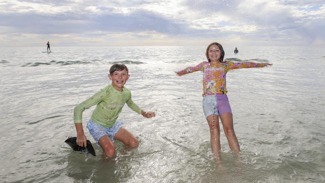 Kai and Marlie of Clarence Gardens cool off at Aldinga. Picture: Brett Hartwig