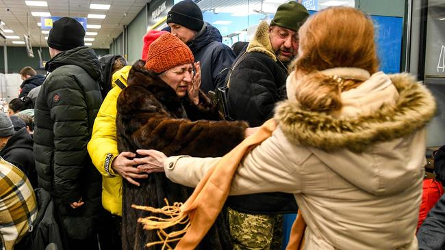 People help an elderly woman who fled Mariupol this week. Picture: AFP